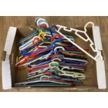 A box of 50 assorted coloured plastic coat hangers.