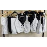 4 matching waistcoats and 3 pairs of trousers in black and white pinstripe design.