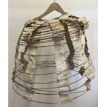 An antique Thomsons 'Empress Duplex' dress hoop No. 78. Some age related wear & rusting.