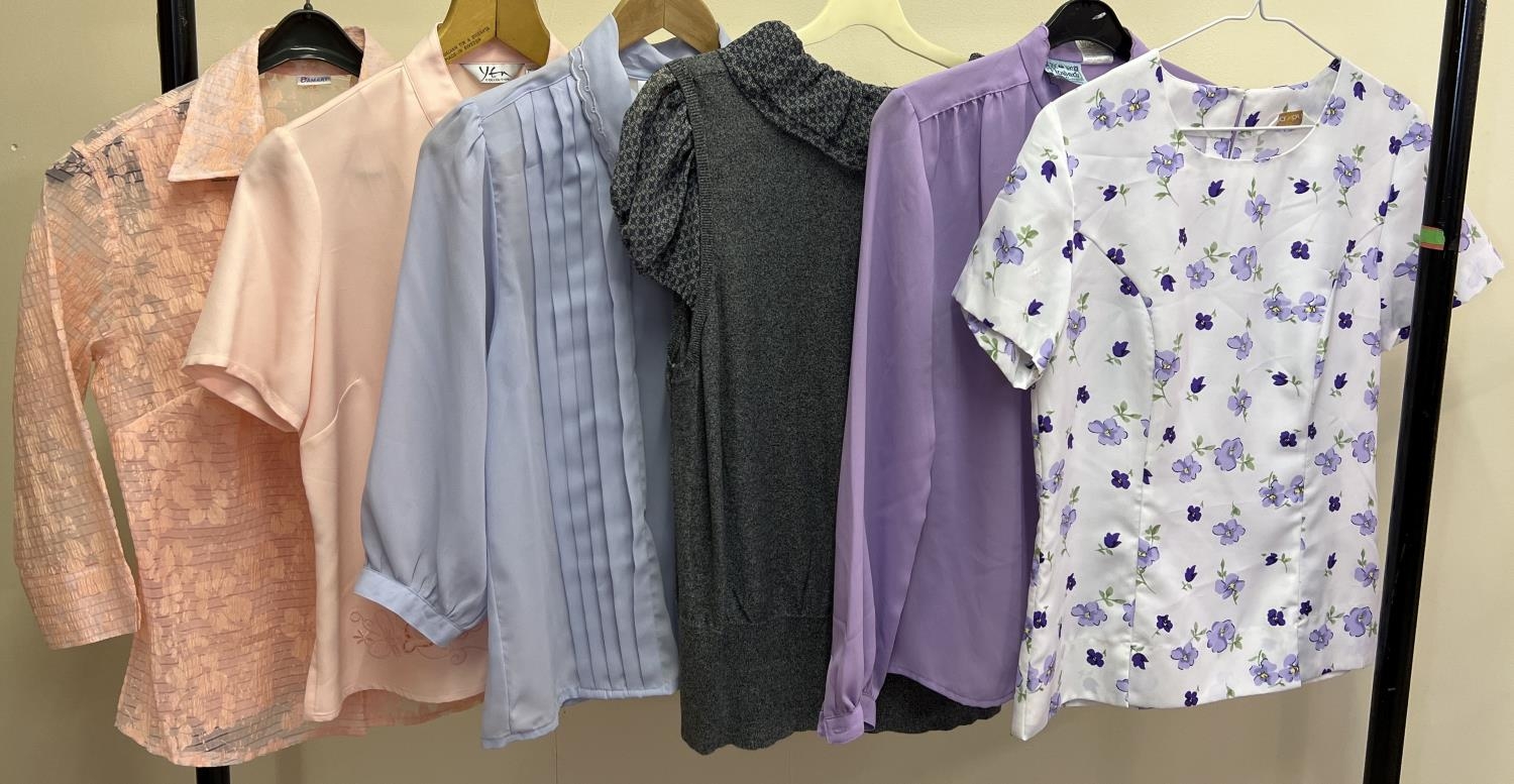 6 women's blouses in short and long sleeve styles to include floral pattern and applique design.