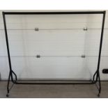 A black metal 4 sectional clothes rail on wheels. Sturdy hollow metal tubes slot together. Approx.