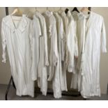 9 vintage white cotton night shirts, dresses and undergarments.