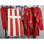 A collection of theatre costume tunics in the style of Beefeater and Royal Guards.