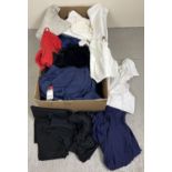 A box of assorted ladies wear to include shorts, blouses, tops, skirts and dresses. Some new with