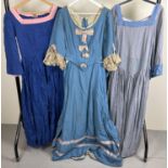 3 theatre costume period style dresses in shades of blue.