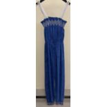 A 1980's blue and silver terry towelling jumpsuit with embroidered detail to neckline and leg