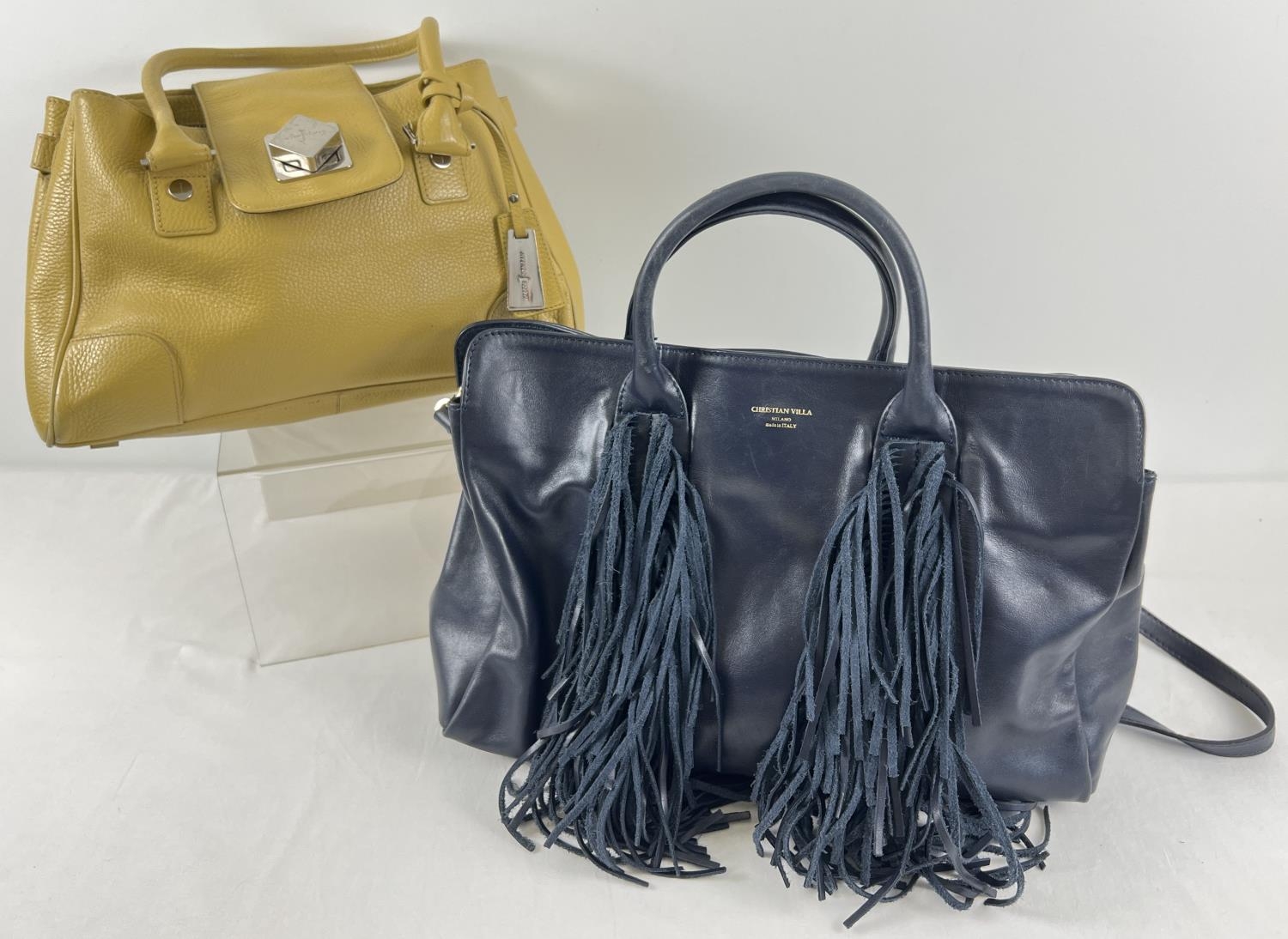 2 designer leather handbags. A mustard leather grab bag by Jasper Conran together with a navy blue