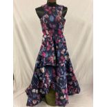 A Terani Couture sleeveless asymmetrical hi-low ball gown of floral design. Size 8.