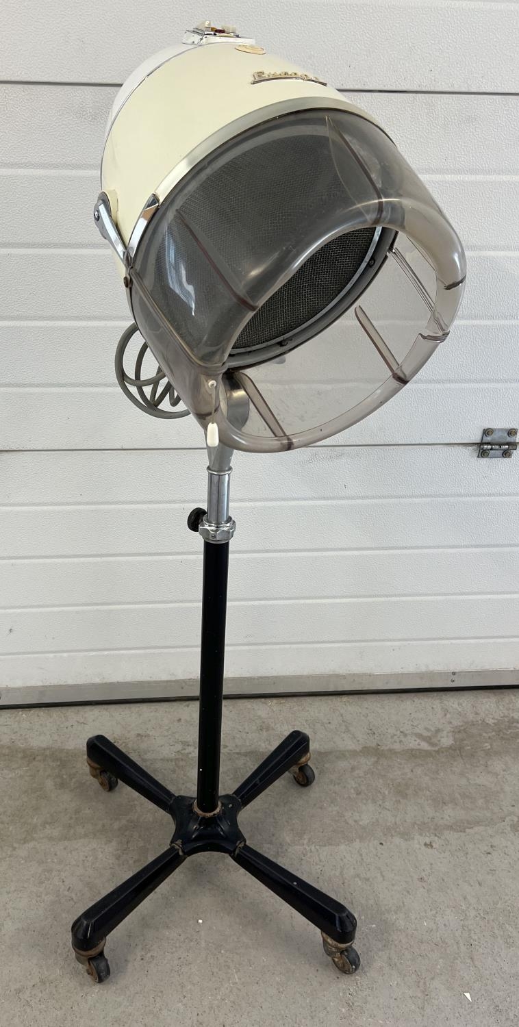 A vintage 1960's floor standing adjustable height Europa hairdryer by Eugene. On wheeled feet.