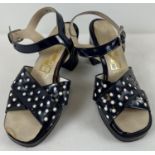 A vintage 1970's pair of navy blue polka dot platform sandals by Premier, size 4.
