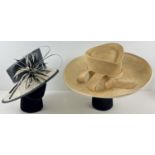 2 ladies occasion hats. A navy blue and cream hat with feathered flower detail by John Lewis,