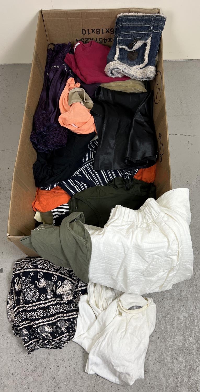 A box of assorted ladies wear to include tops, cardigans, skirts and shorts.