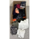 A box of assorted ladies wear to include tops, cardigans, skirts and shorts.