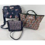 3 designer handbags by Cath Kidston. A navy floral over the body bag with canvas strap, a floral