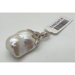 A silver and baroque pearl pendant with original tags. Approx. 3.5cm x 1.75cm including bale. Silver