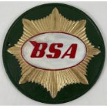 A cast metal BSA Motorcycles, circular shaped wall hanging plaque. In green, white, red and gold.