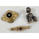 3 antique and vintage brooches. A Victorian mourning brooch set with onyx and a central diamond,