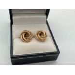A pair of 9ct yellow gold twisted knot style stud earrings. Butterfly backs marked 375. Earrings