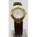 A ladies 75992 wristwatch by Maurice Lacroix. Gold plated case with white face, gold tone hands