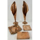 A small collection of copper ware. To include Arts & Crafts style leaf vases. Approx. 32cm tall.