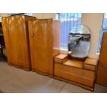 An Art Deco birds eye maple veneer bow fronted 4 piece bedroom suite. With inlaid banded detail