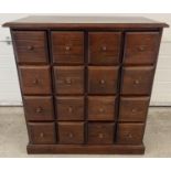 A vintage dark wood 16 drawer chest. With square shaped drawers and wooden knob handles. Approx.