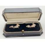 A boxed pair of novelty silver cufflinks in the shape of rabbits, by Chamberlain Clarke. Makers mark
