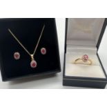 A ruby and diamond silver gilt stud style earrings, pendant necklace and dress ring matching set.