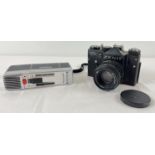A vintage Zennit TTL 35ml SLR camera with Helios -44m lens. Together with a vintage Grundig