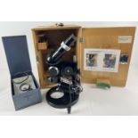 A PZO dissecting microscope with extra lens, in fitted wooden case with carry handle and key.