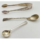 A pair of Victorian silver sugar nips with floral detail to sides together with 2 vintage silver
