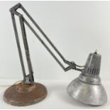 A vintage angle poise lamp with various markings. Stand Marked "Norway" and sticker for "1001