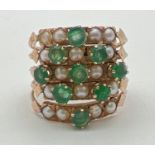 A vintage gold, emerald and seed pearl harem ring. Ring consists of 5 small bands each set with