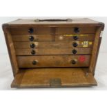 A vintage wooden M & W (Moore & Wright) engineers 7 drawer tool chest. Bakelite handles to all
