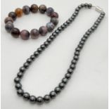 A boxed 18 inch hematite round bead necklace with magnetic clasp, together with an expanding natural