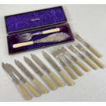 A boxed set of fish servers with bone handles, floral engraving and silver collars. Together with