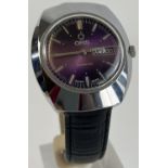 A men's automatic wristwatch by Oris with black leather strap. Silver tone case with purple face.