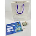 A pale gold Cornwall 7.5mm pearl with certificate and original bag. Together with a pearl on an