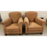A pair of vintage 1930's horse hair armchairs. With wooden bun front feet, raised on brass