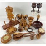 A box of assorted vintage turned and carved wooden items to include African ethnic pieces. Lot