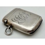 An Edwardian silver vesta case with engraved "ECB" initials to front, striker to base and hanging