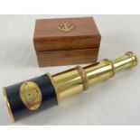 A small 3 drawer brass marine telescope in a wooden box embossed with brass anchor. Box approx. 5.