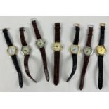 7 assorted quartz men's wristwatches with black & brown faux leather straps.