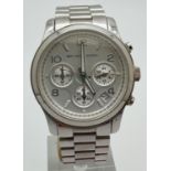 A Michael Kors men's chronograph MK5076 wristwatch. Stainless steel strap and case. White face