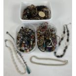 3 tubs of vintage and modern costume jewellery necklaces in varying styles and conditions.