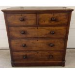 A Victorian mahogany 2 over 3 chest of drawers with original knob handles and brass escutcheons.