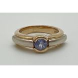 A modern design 14k gold tanzanite solitaire style dress ring by Le Vian. White and yellow gold