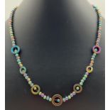 An 18" beaded necklace made from electroplated hematite beads with a rainbow lustre. S shaped hook