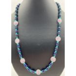 A 22" beaded necklace made from amethyst, turquoise and lapis lazuli beads. With silver tone T bar