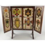 A vintage dark wood folding screen with embroidered tapestry panels. Approx. 68cm tall x 50cm